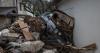 Bosnian villagers sift through ruined homes after devastating flash floods