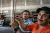 A father and son duo fight invasive lionfish on a Honduran reef
