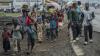AP PHOTOS: Thousands flee fighting in Congo as rebels claim they’ve captured the key city of Goma