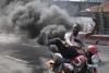 Congo tries to slow assault of Rwanda-backed rebels amid reports of dead bodies in streets