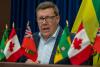 Saskatchewan Premier Scott Moe, left, and Ontario Premier Doug Ford attend a news conference on Sunday in Saskatoon, where they signed an agreement to reduce trade barriers.