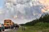 Saskatchewan RCMP charge two in wildfires while Manitoba fires force 1,000 more to evacuate
