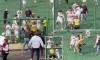 Incredible scenes as Brazilian football match descends into mass brawl with Military Police called after linesman lashed out at teenage player