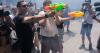 Spaniards squirt water guns at tourists in Barcelona and Mallorca to protest overtourism