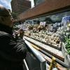 A man prays for the health of the Colombian presidential candidate Miguel Uribe during his surgery outside the Fundacion Santa Fe clinic in Bogota on June 16, 2025.