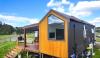 Couple shares inside look at lifestyle after leaving US to build tiny home and retire early: 'Dream house in a dream country'
