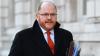 Ex-Tory minister suspended as trade envoy over 'cash for questions' claims