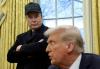 Elon Musk listens to U.S. President Donald Trump speak in the Oval Office of the White House in Washington, D.C., on Feb. 11. The two are feuding again, as Trump's 'big, beautiful bill' — a budget reconciliation bill that is projected to add trillions …