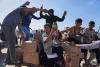 U.S. aid contractors are firing live ammunition as Palestinians seek food in Gaza, sources say