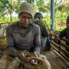 Workers take a break from picking bananas in the Dominican Republic