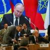 Russia's President Vladimir Putin is seen projected on a screen during the first plenary session of the BRICS summit in Rio de Janeiro, Brazil, on July 6, 2025.
