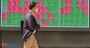 Japan's Nikkei ends higher on weaker yen, profit-taking limits gains