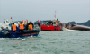 Tourist boat capsizes in Vietnam’s Halong Bay storm, 27 dead as rescuers search for survivors