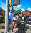 Pulling for votes? Mayor Adams does pull-ups off a Brooklyn street light in social media challenge
