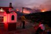 Greece wildfire contained but evacuations continue amid strong winds