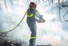 Firefighters battle to prevent re-ignition of France’s  largest wildfire as residents return home