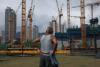 Fire sales and defaults deepen Hong Kong commercial real estate crisis
