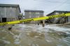 Hurricane Erin stirs up strong winds, floods part of main highway as it creeps along the East Coast