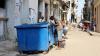 A man’s head appears in a garbage container in Santiago de Cuba.