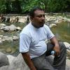 A judge in Honduras has ordered three men to stand trial for the murder of Honduran environmentalist Juan Lopez, seen here in 2021 as he watched the Guapinol river in Honduras