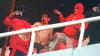 A fan of Universidad de Chile bleeds while being hit by fans of Independiente during the interruption of the Copa Sudamericana round of 16 second leg football match between Argentina's Independiente and Chile's Universidad de Chile at the Libertadores…
