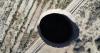 Giant sinkhole in Chilean mining town haunts residents, 3 years on