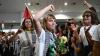 Swedish flotilla activist Greta Thunberg raises her fist after arriving at Athens
