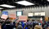 Dozens stand in silent protest of Sen. Sullivan during address to the Alaska Federation of Natives