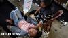 Protests and food poisonings test Indonesian president's first year in office