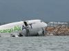 Cargo plane skids off Hong Kong runway into sea