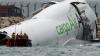 Cargo plane slides off runway in Hong Kong, killing 2 airport staff