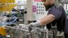 UK business activity improves as manufacturing returns to growth