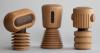 mini sculptural robots for homes are crafted entirely from danish oak wood