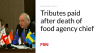 Tributes paid after death of food agency chief