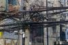 Resetting Dhaka's overhead electric cables underground stalls