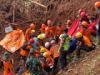 Indonesian rescuers search for missing people after landslides killed at least 18 people