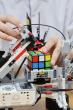 Kazakh Teen Engineer Designs Robot That Solves Rubik’s Cube in 60 Seconds