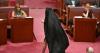 Far-right Australian senator draws ire by donning a burqa in parliament