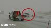 Watch: Car nearly hits first responders in Midwest blizzard conditions
