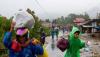 Indonesia landslides, deluge kill 34; rescue hampered
