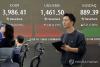 Seoul shares trade lower late Fri. morning on tech slump