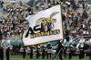 Tuskegee kicker kicks ball at Alabama State marching band during halftime show