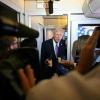 US President Donald Trump speaks to journalists aboard Air Force One while traveling home from Florida to the White House