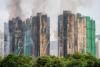 13 people under arrest on suspicion of manslaughter in Hong Kong fire