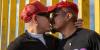 HIV-positive men stage 'Kiss-In' protest at U.S.-Mexico border (in pics)