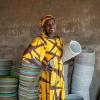 Khady Sene, 35, who stands with a shipment of baskets destined for Denmark, says she has been weaving 'since I was born'