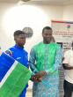 Minister Badjie Hands Over National Flag to Team Gambia