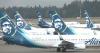 Passenger restrained after trying to open Alaska Airlines exit door mid-flight
