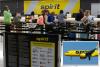 2 Spirit Airlines employees charged for stealing a passenger’s $500 Louis Vuitton purse