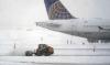 Northeast US snowstorm halts travel, causes flight cancellations